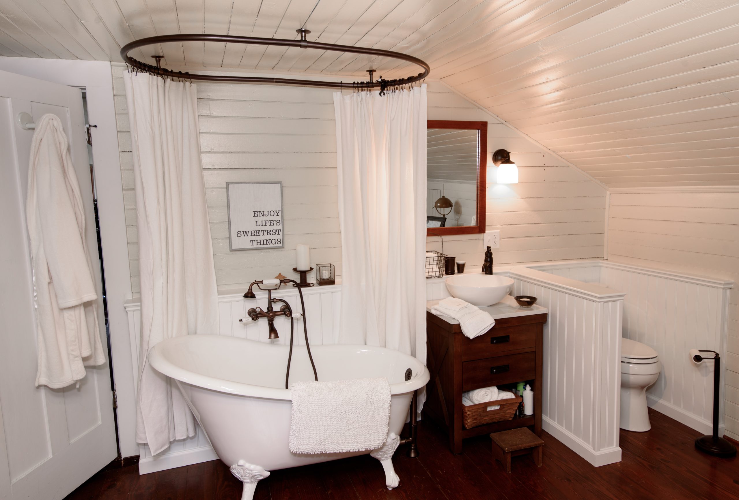 Claw foot tub in newly renovated bathroom.