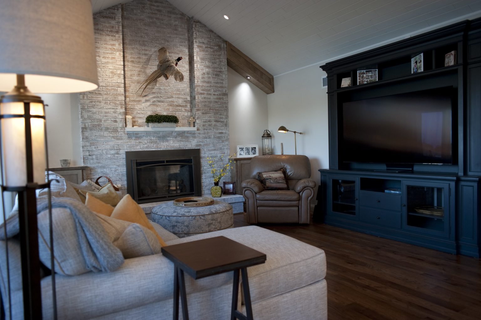 Modern fireplace with stone surround installed by Perrysburg home remodeler